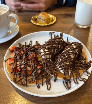 Fruit crepes with chocolate drizzle